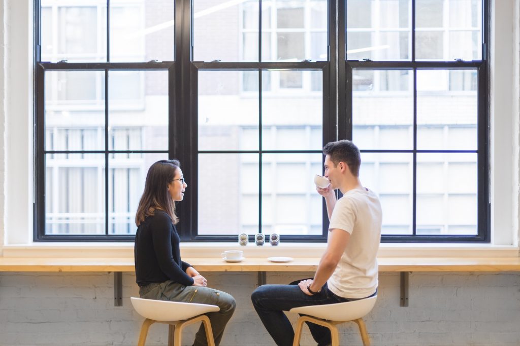 Two people in a cafe